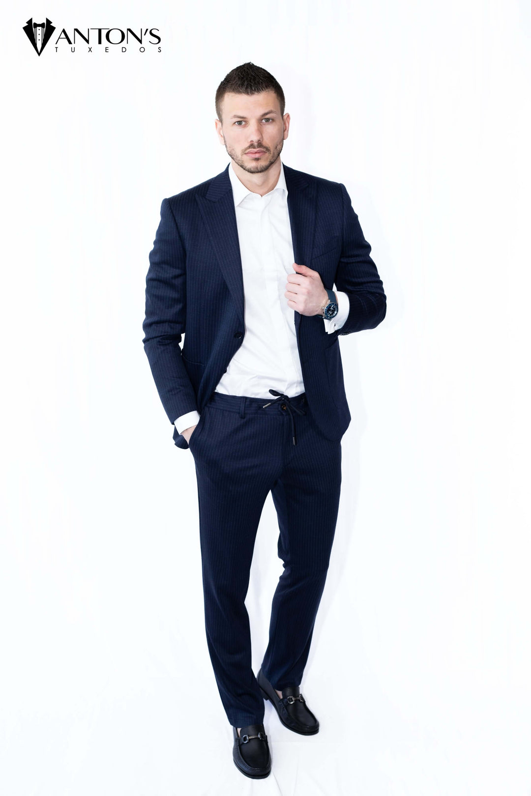 "Model wearing Anton’s summer collection suit made of 100% Italian wool, ideal for wedding tuxedos, formal menswear, and groom attire."