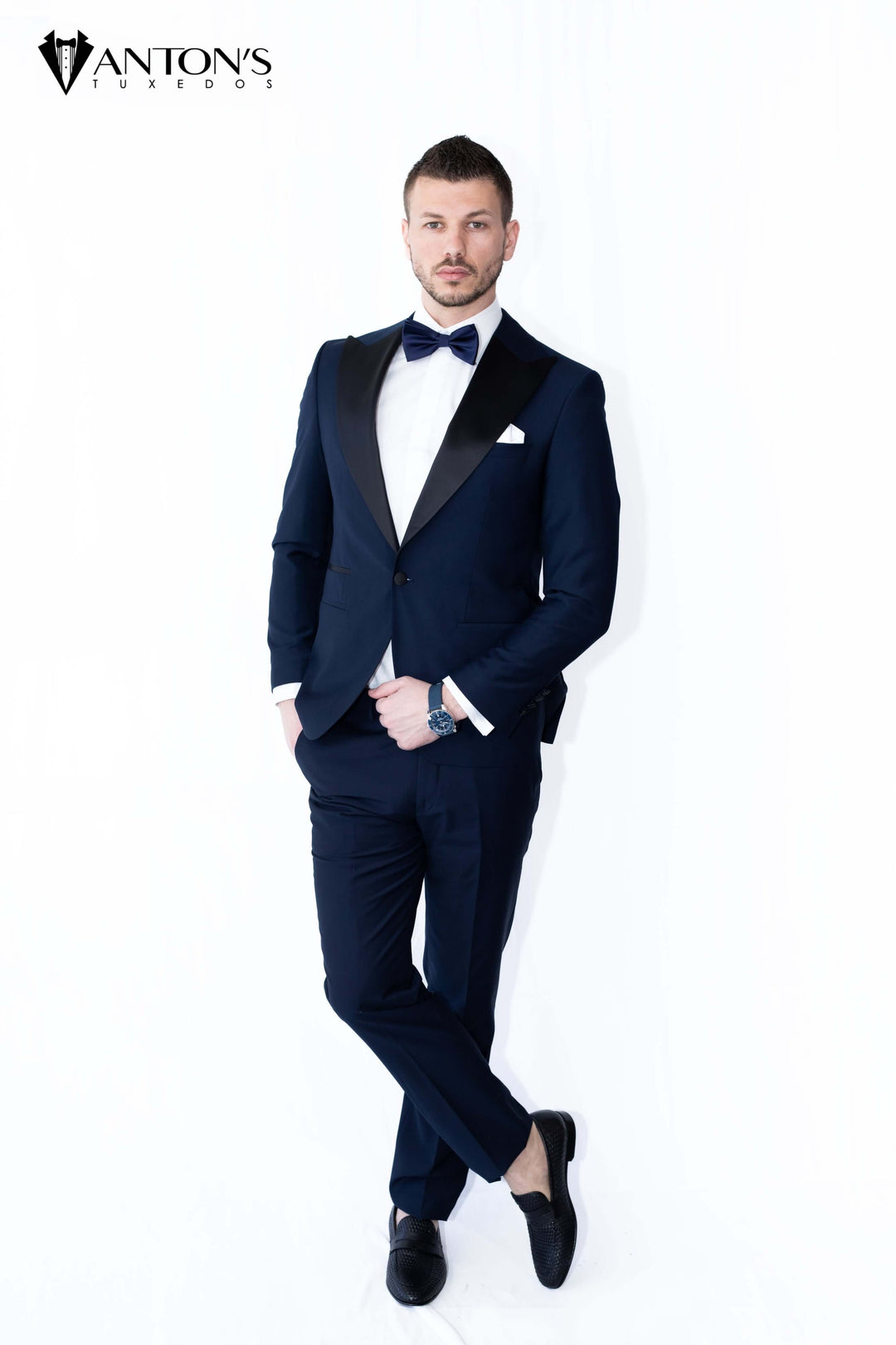 Navy blue tuxedo with black peak lapel made of 100% Italian wool, ideal for wedding tuxedos, formal menswear, and groom attire