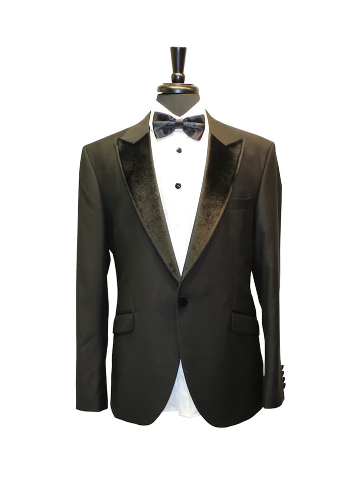 Velvet Black Tuxedo on mannequin with satin lapels and matching bow-tie, tailored for formal events, exuding sophistication and style.