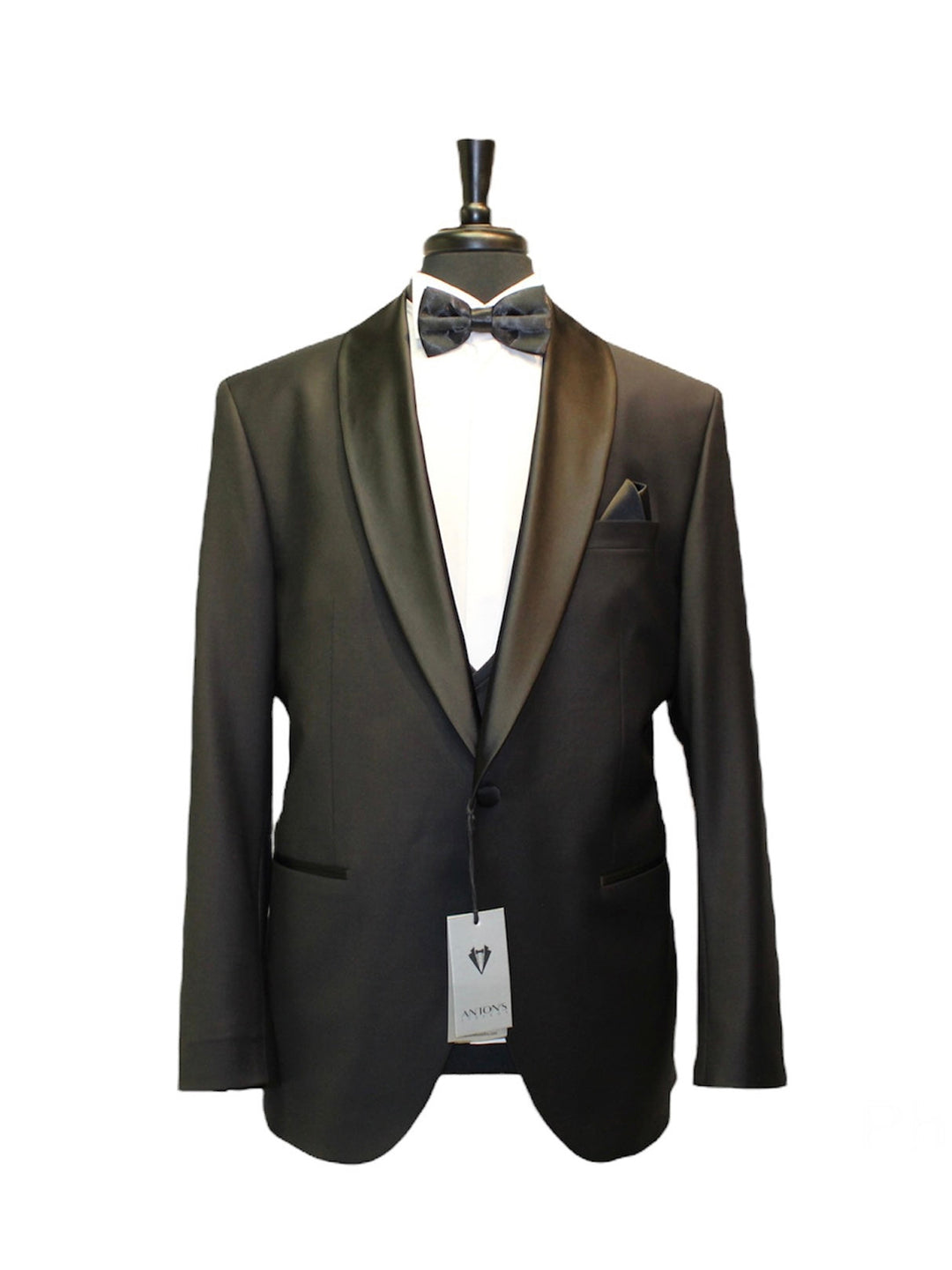 Black wool slim fit tuxedo jacket with satin lapels on display mannequin, part of 3 piece set including vest and pants. Ideal for formal occasions.